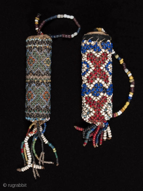 Beaded lime containers,
Timor Island, Indonesia,
Seed beads, cork, string
2.75 " (14.6 cm) and 3" (19.6 cm) high.
Early to mid 20th century. Sold separately           