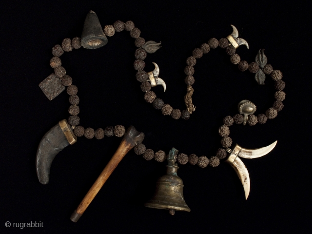 Shaman's mala,
Nepal.
Rudraksha beads, bone, horn, brass, seed pods, string.
41" (104 cm) long.
19th century. 
                   