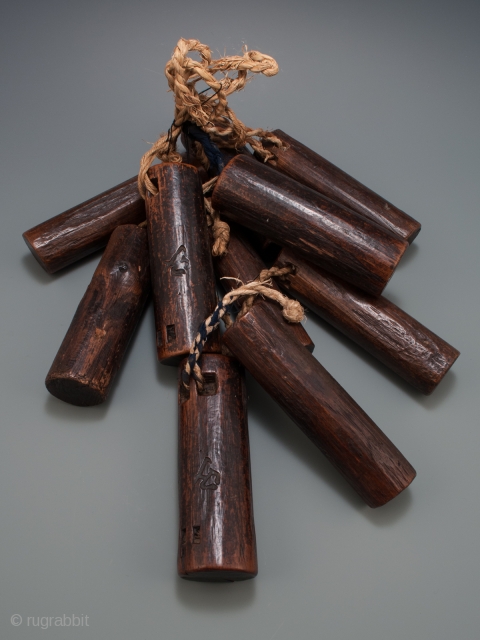 Ten loom weights, Japan.
Wood, string.
Meiji Period.
5.5" to 6" (14 to 15.2 cm) long.
                    