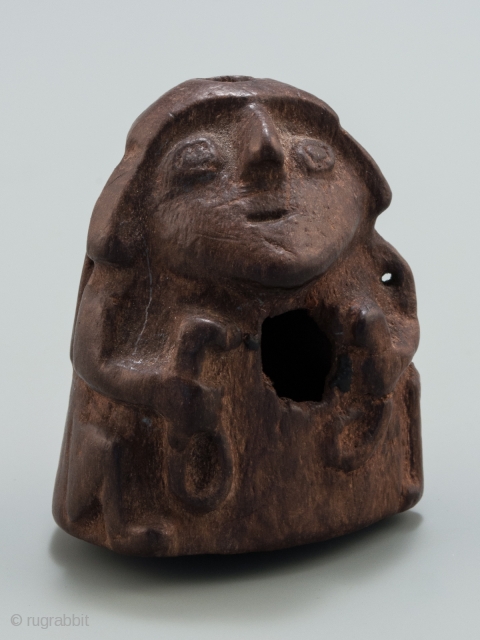 Stargazer shaman lime container,
Huari, Peru.
Wood,
1.75" (4.5 cm) high.
A.D. 700-1000.

This lime container depicts a 'stargazer' shaman holding the tools of his trade. Lime containers were personal items and a 'kill hole' was made  ...