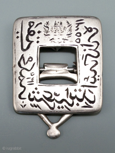 Silver stamp,
Afghanistan.
1.5" (3.8 cm) high by 1.25" (3.2 cm) wide, 48 grams.
1921.
The crest on this commemorative stamp is the national emblem of Afghanistan. The date at the top right is 1300, which  ...