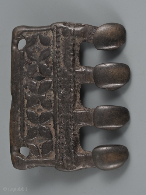 Buckle thokcha,
Tibet. 11th to 12th century.
3" (7.6 cm) high by 2.5" (6.3 cm) wide.                   