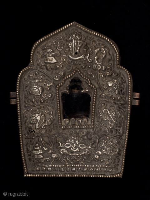 Gau prayer box, Tibet, with a small ceramic figure on the inside of the back panel. It can be seen through the glass window. These were worn while traveling or kept in  ...