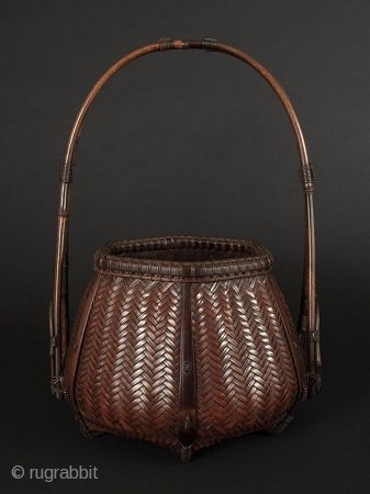 Japanese Antique Bamboo Basket Signed


Japanese antique bamboo basket, with beautiful handle attached at the lower sides and bound with special decorative stylized knots. Hexagonal body of woven herringbone pattern. Feet at bottom  ...