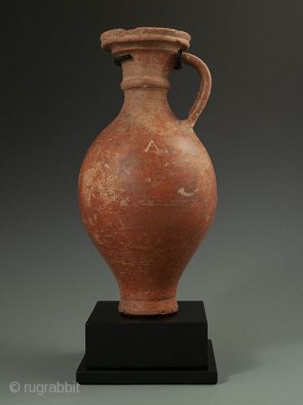 Antique Roman Vase with Stand

Red clay Roman pottery vessel with handle, flanged lip over curved body, worn white design, most likely a wine ewer, display stand.

Provenance Handley Collection 

Date 300 AD 

Size  ...