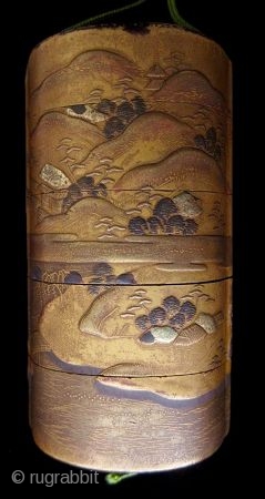 Antique Japanese Gold Landscape Inro
Japanese gold lacquer inro with five compartments, decorated in low relief landscape scene of lakeside mountains, cottages, pagodas, pine trees, and bridges in gold lacquer and accents of  ...