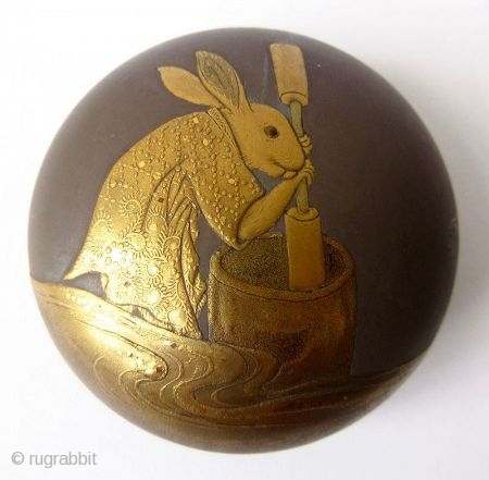 Charming 18th C. Japanese Lacquer Kogo with Rabbit Pounding Mochi
A round Japanese kogo or incense box with sprinkled gold lacquer maki-e motif of an anthropomorphic rabbit pounding mochi. The rabbit wears a  ...