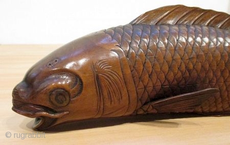 Antique Japanese Carved Okimono of Swimming Carp

Antique Japanese boxwood okimono of swimming carp fish with sinuously shaped body and realistically carved scales and details. Lovely soft patina of golden brown color. Good  ...