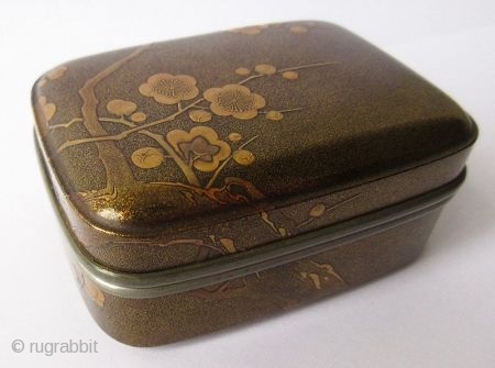 Japanese Lacquer Incense Box with Plum Blossoms
Japanese lacquer incense box with low-relief designs of plum blossoms in maki-e lacquer on finely sprinkled nashiji lacquer ground. The plum branch pattern is continuous along  ...