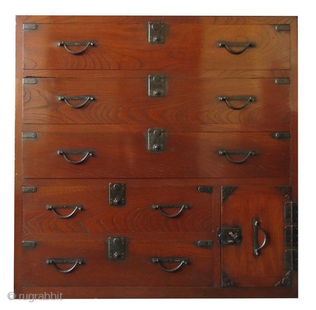 Antique Japanese Keyaki Front Tansu


Unusual Japanese single section isho tansu (clothing chest), with dramatic Keyaki (elm) front drawers, opened by simplistic hirute style handle pulls and small, squared locks. Its bottom safe  ...