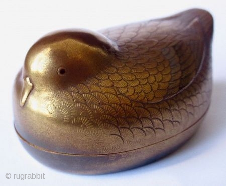 Antique Japanese Maki-e Lacquer Bird Kogo, Signed

Japanese kogo, or incense container for tea ceremonies, in the form of a small bird with very fine maki-e or sprinkled gold lacquer exterior. Each feather  ...