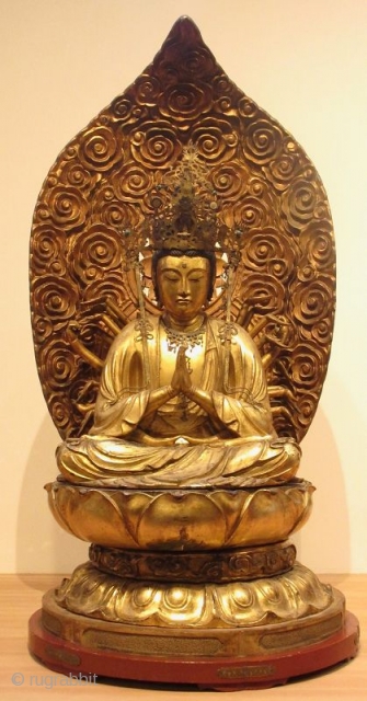 Antique Japanese 24 Armed Kannon Seated Bodhisattva


A large figure of 24 armed seated Kannon, gold gilt over wood carving of the bodhisattva of compassion, seated in meditation atop a lotus pedestal, two  ...