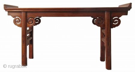 Antique Chinese Hardwood Altar Table

Antique Chinese hardwood altar table with hand carved lingzhi spiral apron joined in upturned flanges. The feet are spanned by an openwork of hand carved panels with drapery  ...