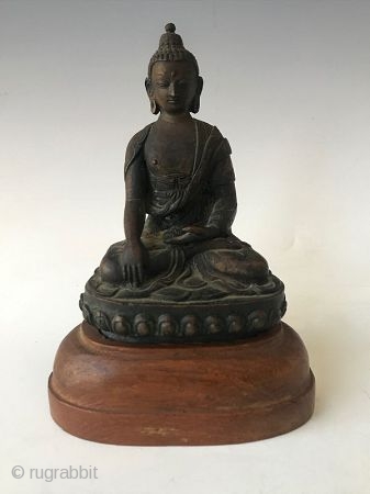 19th Century Sino Tibetan Seated Buddha

Bronze Buddha from Sino Tibetan tradition. Wonderful details on the robe with inscription on back. Buddha sits on a wooden stand. Provenance: From the William Ashby Estate.  ...