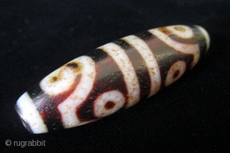 Antique Tibetan 8 Eye Dzi Bead

Antique Tibetan Dzi bead, agate with 8 eyes. The mystical Dzi beads are implements of ancient Tibetan and other Asian cultures for several hundreds of thousands of  ...