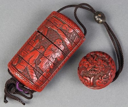 Antique Carved Cinnabar Lacquer Inro w/Manju

An exquisite hand-crafted Japanese cinnabar lacquered Inro with five compartments and Manju. It has a meticulously carved scene with 2 scholars or sages on one side and  ...