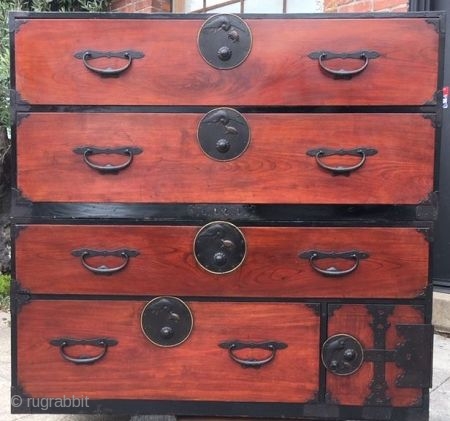 Japanese Antique 2-Section Nihon Matsu Isho Tansu

A Nihon Matsu tansu with beautiful reddish brown lacquered keyaki wood front face with hinoki (cypress) wood drawers. The round lock plates on each drawer feature  ...