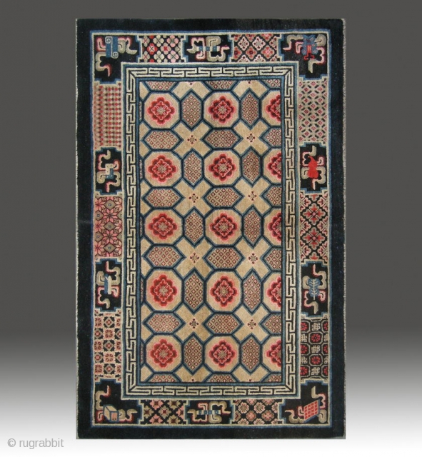 No.M09 * Chinese Antique "Turtle Back Design" Rug , Age:Late 19th Century.
Size:135x212cm(4'5"x6'11"). Origin:Gansu. Shape:Rectangle. Background Color:Yellows.
Turtle back design over the field. There are Symbols of the Four Accomplishments and the eight symbols  ...