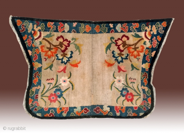 No.DX089 * Chinese Tibetan Lady Saddle Rugs.Age: Early-20th Century.Size: 70 x 110cm (2'3"x3'7").Origin: Tibet. Shape: Papilionaceous.Background Color: Off-whites,lvory. Flower design with stylized floating cloud motifs.        