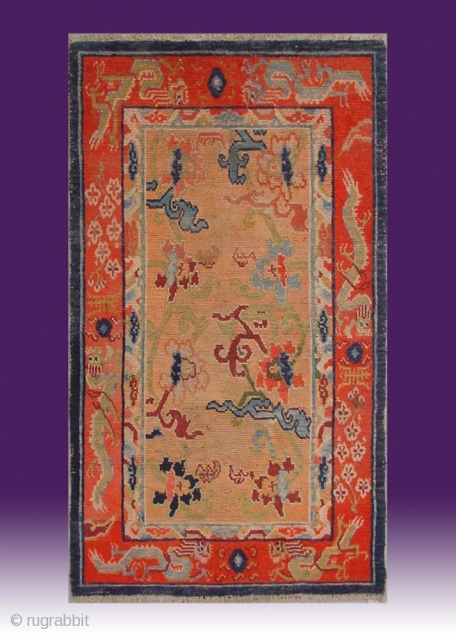 No.X0010 * Tibetan Antique "Dragons + Flowers" Rug . Origin: Tibet  Age: About 100 Years Old. Size: 84x141cm(33"x56"). Shape: Rectangle.Background Color: Orange. cotton/wool.         