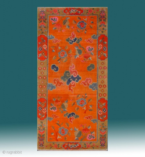 No.R107 * Tibetan Antique "Clouds and The Three Fruits " Rug. Early-20th Century. Size: 90x180cm ( 2'11" x 5'11" ).Origin: Tibetan.Shape: Rectangle. Background Color: Oranges. cotton/wool.
This ecclesiastical rug boasts an orange colored  ...