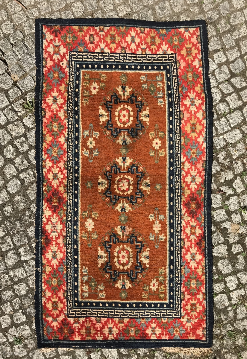 charming and decorative pair of tibetan rugs, slightly different sizes