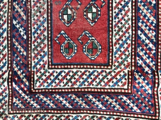 Description and origin: Caucasian carpet with a simple and attractive "Gendje". With a red relatively narrow main field made of ten "Boteh" designs, a comb and an S motif.
Rare triple border with  ...