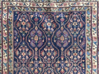 Description and origin: Caucasian carpet with an original geometric border and a main field composed or repetitive floral design.

Age: anterior to 1950.

Dimensions: 187 cm X 132 cm.

Condition: overall good condition. Low pile.  ...