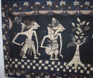 Handsome Wayang Batik from Java: Circa 1925. Good condition with a couple of small holes and light fading on one side. Deep indigo.          