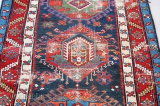 Just in! 19th century North-west Persian runner. 4.00m x 1.05m  (13' x 3'6"). Really good colours, and strong design. Archaic drawing of the medallions. Note also how each medallion is different!  ...