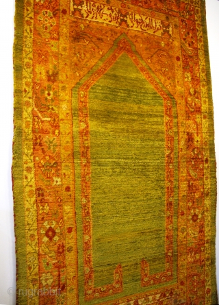 19th century Ushak Prayer Rug 2.14m x 1.23m (7'1" x 4'), wonderful fleecy Angora wool, silky texture. Great architectural drawing with inscription above the cartouche. Very good condition, with very minor restoration.  ...