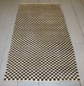 Tibetan Checkerboard Rug, 1.62m x 0.93m (5'3" x 3'1")
Alternate squares of dark blue and undyed ivory wool. Subtlety and texture are provided by the abrash and the slight variation in each of  ...