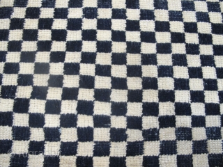 Tibetan Checkerboard Rug, 1.62m x 0.93m (5'3" x 3'1")
Alternate squares of dark blue and undyed ivory wool. Subtlety and texture are provided by the abrash and the slight variation in each of  ...