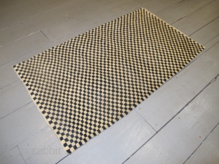 Tibetan Checkerboard Rug, 1.62m x 0.93m (5'3" x 3'1")
Alternate squares of dark blue and undyed ivory wool. Subtlety and texture are provided by the abrash and the slight variation in each of  ...
