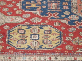 Soumac carpet 2.75m x 2.32m (9' x 7' 8") circa 1880. Superb colour range, with unusual quadruple medallion format. Heavy corrosion of the browns but in honest 'estate' condition. Most of the  ...