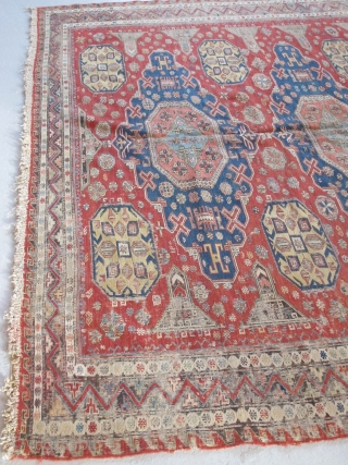 Soumac carpet 2.75m x 2.32m (9' x 7' 8") circa 1880. Superb colour range, with unusual quadruple medallion format. Heavy corrosion of the browns but in honest 'estate' condition. Most of the  ...