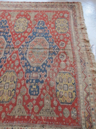 Soumac carpet 2.75m x 2.32m (9' x 7' 8") circa 1880. Superb colour range, with unusual quadruple medallion format. Heavy corrosion of the browns but in honest 'estate' condition. Most of the  ...