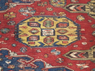 Soumac carpet 2.75m x 2.32m (9' x 7' 8") circa 1880. Superb colour range, with unusual quadruple medallion format. Heavy corrosion of the browns but in honest 'estate' condition. Most of the  ...