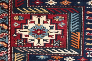 Antique Kuba long rug. Dated 1.904 (AH 1322),  375 x 135cm ( 101,5”x 66”).  
CAUCASIAN
 
This carpet features the appealing “Keyhole Design”. Two of the so-called ‘carnation’ borders, typical of  ...