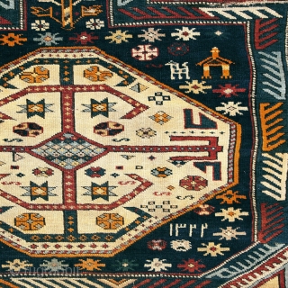 Antique Kuba long rug. Dated 1.904 (AH 1322),  375 x 135cm ( 101,5”x 66”).  
CAUCASIAN
 
This carpet features the appealing “Keyhole Design”. Two of the so-called ‘carnation’ borders, typical of  ...