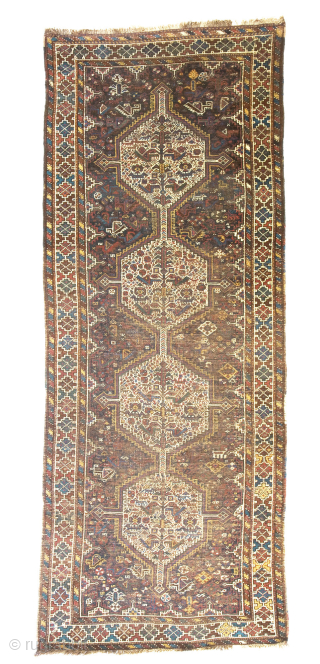 Khamseh rug, first quarter 20th century, 260 x 103 cm (102” x 40,5”)
South Persia Tribal

A rug woven by members of the Khamseh Arab tribe, with the classic line of medallions enclosed by  ...