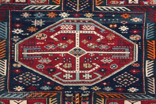 Antique Kuba long rug. Dated 1.904 (AH 1322),  375 x 135cm ( 101,5”x 66”).  
CAUCASIAN
 
This carpet features the appealing “Keyhole Design”. Two of the so-called ‘carnation’ borders, typical of  ...