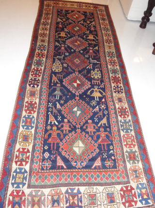 Antique Caucasian Gendje Rug With Persons, late 19th century
319 cm x 114 cm
An extraordinary rare, charming, collectible and decorative tribal antique rug from Gendje, in the Central Caucasus. It transmits a festive ...
