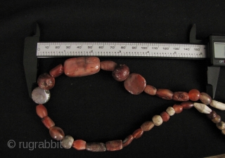 Nice strand of Kushan/Bactrian of mixed stone (mostly carnelian) beads. I acquired these along with coins dating from 1st- 4th CE from the same site in North West Pakistan, so these can  ...