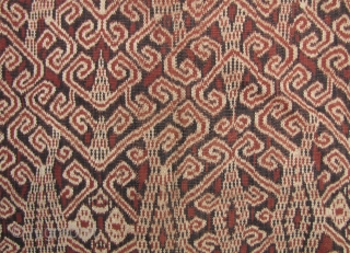 

Outstanding Iban woman’s skirt depicting hawks flying over the forest. The contrast between the black and brown on the background really conveys the interplay of light and shadow as seen up through  ...