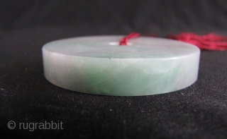 Chinese Jadeite Bi: Nice heavy Jadeite Bi with subtle green and lavender highlights. There is a big crack running all the way through otherwise this piece would retail $300/$400 here in Hong  ...