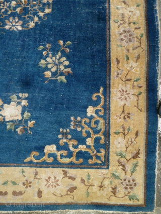 China Rug: Beijing/Tianjin carpet circa 1910, with floral design throughout. Worn down to the warp and weft in many places but no big tears and the selvedge seems to be complete and  ...