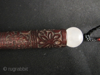 Chinese Bamboo Carving: Delightful bamboo fly whisk handle pendant from the Hani (Akha) minority, Yunnan. China. Great patina with intricate designs consisting of double dorjes, various flowers and seal script Chinese characters-  ...