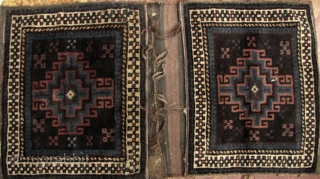 Baluch Saddle Bag An excellent complete Afghan Baluchi saddle bag pair. All wool, natural dyes, handwoven, and lovely pile with subtle abrash. The flat weave back is just as beautiful as the  ...