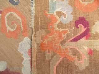 



Tibetan Khaden rug with auspicious bats and scrolling peony pattern.  L: 160cm/62in and W: 94cm/37in. Undyed wool warp and weft and the pile may be possibly undyed as well, quite unusual  ...